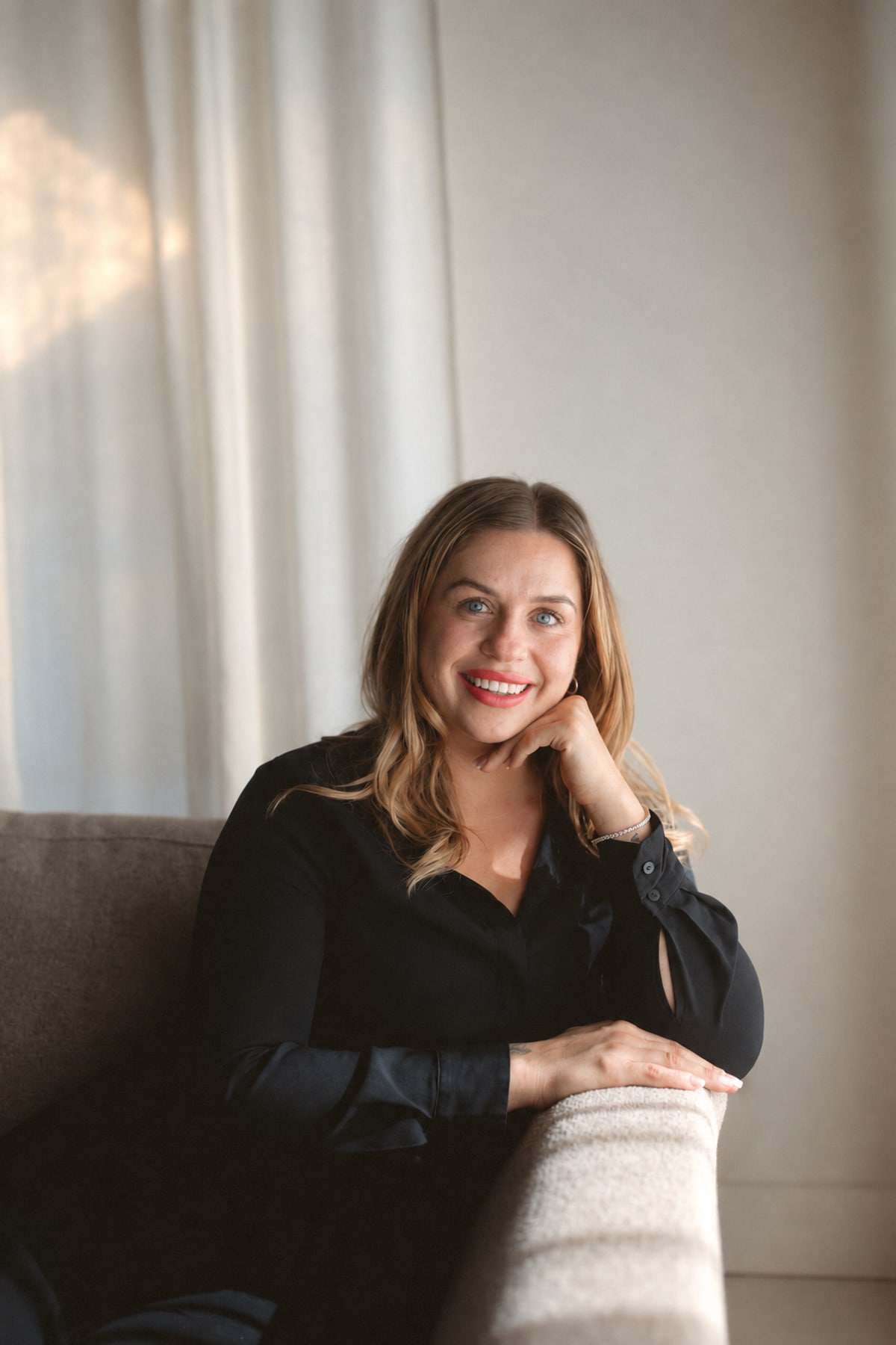 Kristen Lawrynowycz seated beside a chair